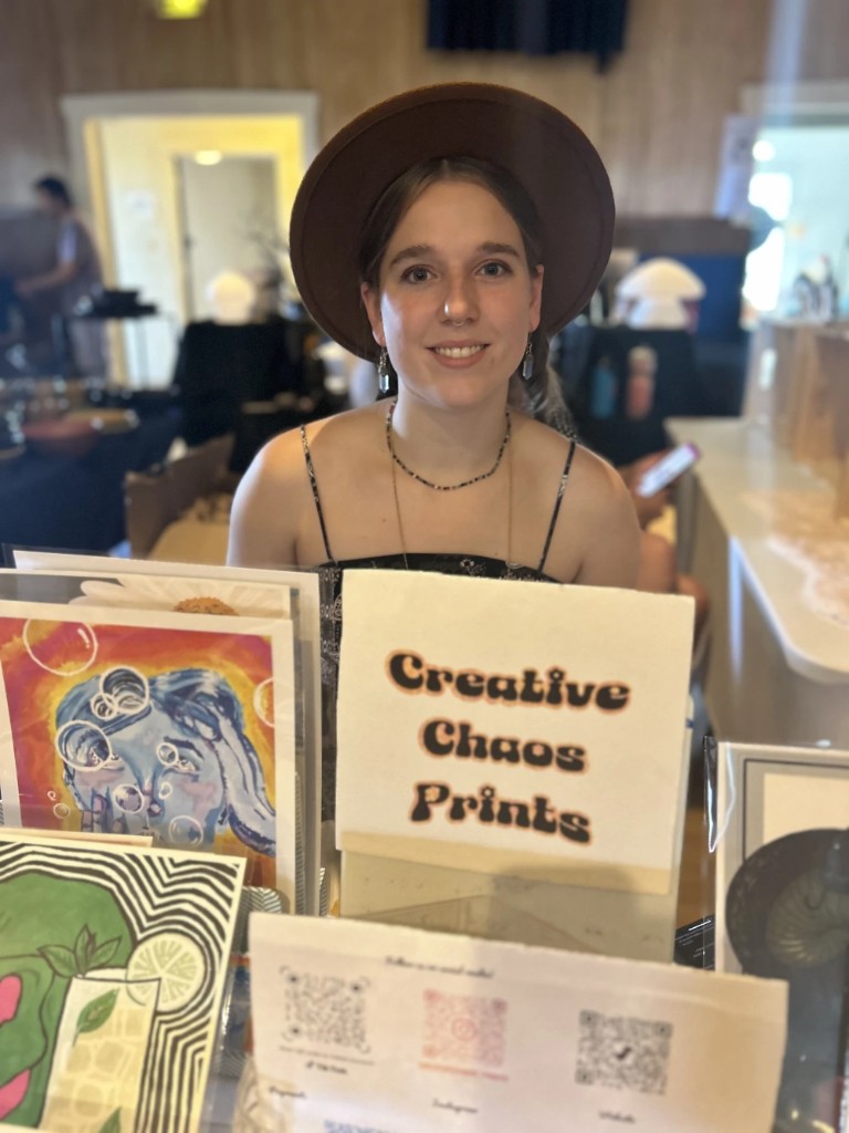 Jessica selling Creative Chaos Prints at a local market